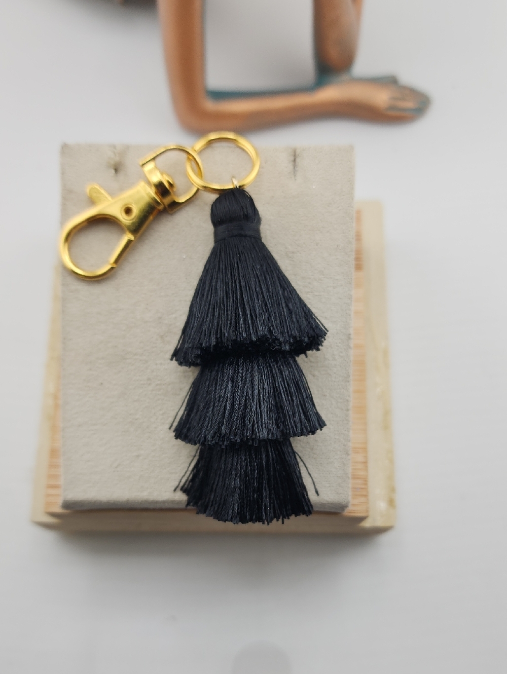 Black Tiered Tassel Bag Charm Keychain with Gold Hardware